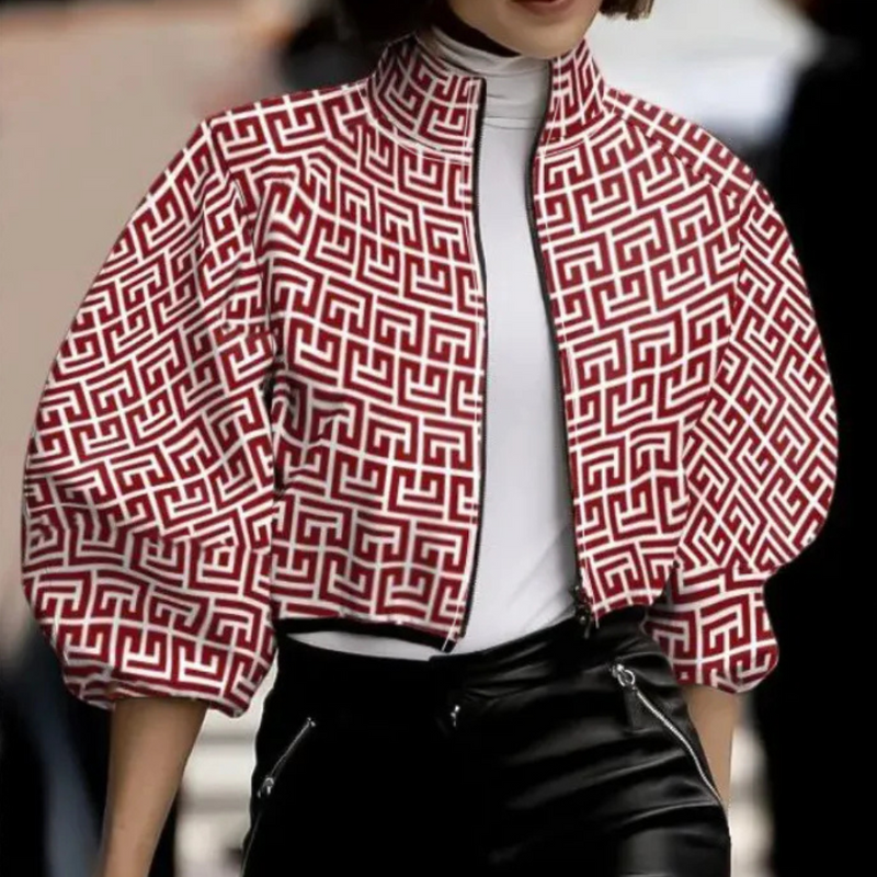 Damenjacke mit rotem geometrischem Muster, Reißverschluss, modisch, elegant, Herbstmode.
