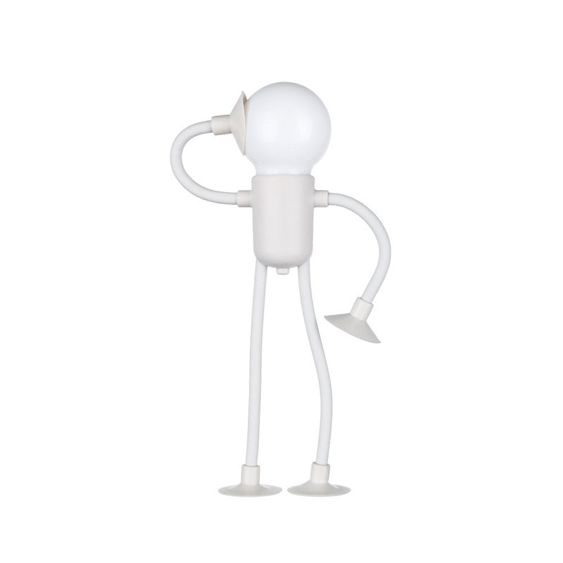 Weiße Figurenlampe mit Glühbirnenkopf, die einen Arm an den Kopf legt, steht auf zwei Saugnapf-Füßen vor weißem Hintergrund. 2