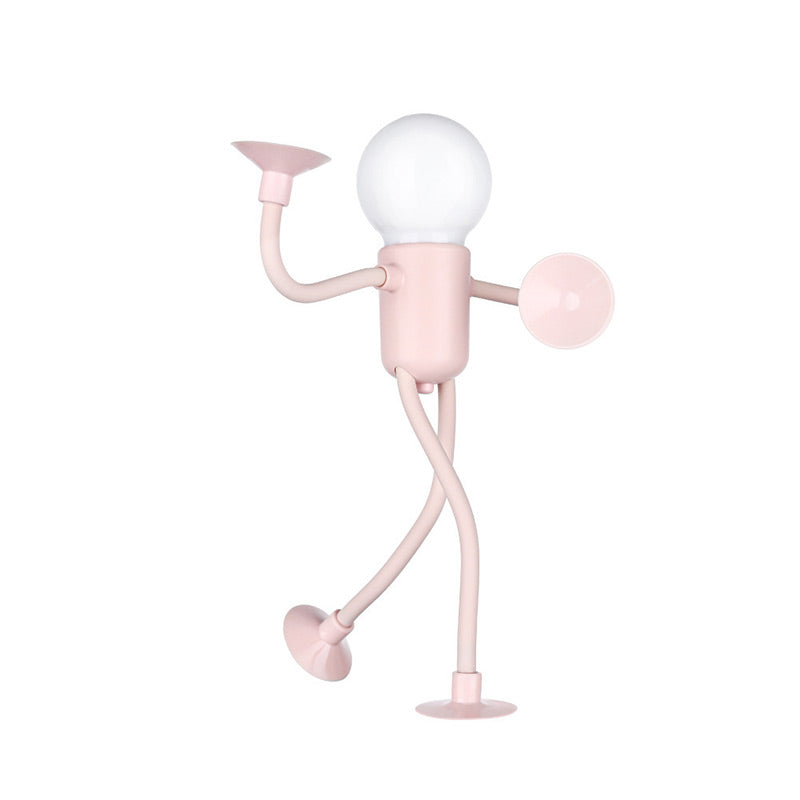 Rosa Figurenlampe mit Kugelkopf in Tanzpose, ein Bein angehoben, Saugnäpfe an Händen und Füßen, freigestellt auf weißem Hintergrund. 3