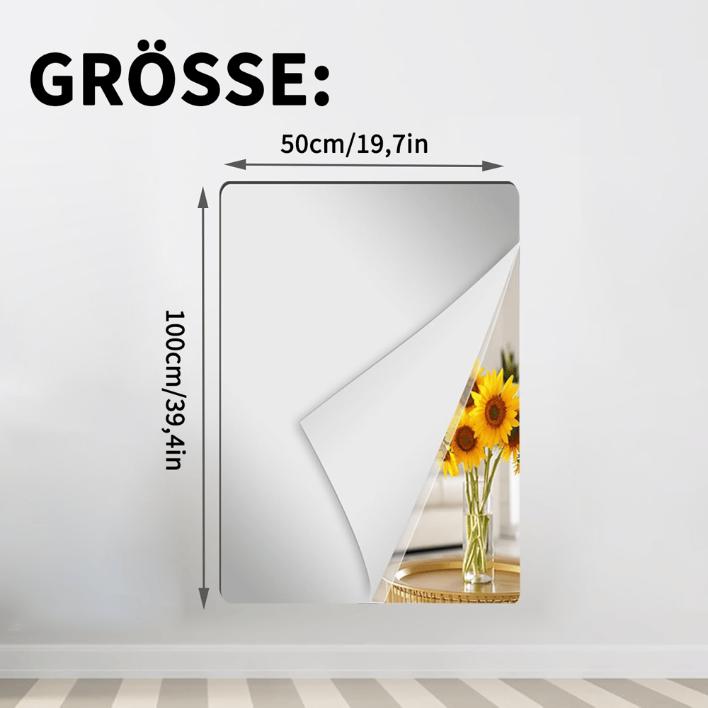 Rechteckige Spiegelfolie an einer Wand mit abgelöster Ecke und Sonnenblumen im Spiegelbild, Maßangaben für die schmalere, höhere Variante. 12
